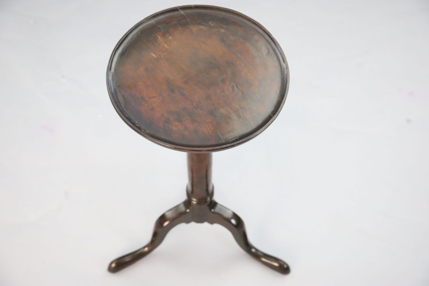 A George II yew wood tripod table with dished circular top and turned stem on a cabriole tripod - Image 2 of 3