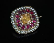 A Georgian gold, garnet, citrine and seed pearl set shaped square brooch, 19mm, gross 6.4 grams.