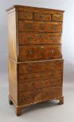 A George II figured walnut secretaire chest on chest, fitted three short and seven graduated long