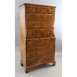 A George II figured walnut secretaire chest on chest, fitted three short and seven graduated long