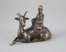 A Chinese late Ming bronze group of an immortal seated on a recumbent deer, 12.5cm longCONDITION: