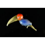 A mid 20th century French 18ct gold, coral and cabochon blue chalcedony? set Toucan clip brooch by