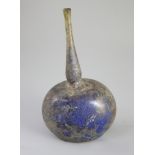 An Islamic blue glass perfume sprinkler, Egypt, c.1250-1350 AD, mould blown with pronounced kick and