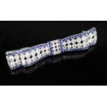 An Art Deco sapphire and diamond bow brooch mounted in white metal, 56mm, gross 8.2