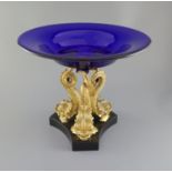 An impressive Regency blue glass and ormolu 'dolphin' centrepiece fruit bowl, the shallow ogee