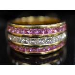 A modern 18ct gold, diamond and pink sapphire set three row dress ring, set with Princess cut