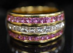 A modern 18ct gold, diamond and pink sapphire set three row dress ring, set with Princess cut