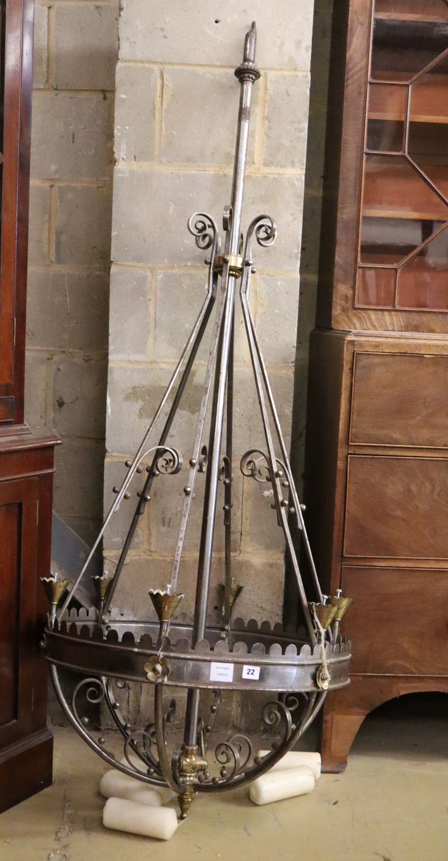 A Victorian steel and brass Gothic style chandelier, with conical brass sconces, drop 5ft 8in,