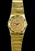 A gentleman's 1980's 18ct gold Omega Constellation quartz wrist watch, the yellow dial with dot