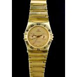 A gentleman's 1980's 18ct gold Omega Constellation quartz wrist watch, the yellow dial with dot