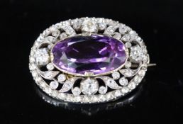 A Victorian gold and silver, diamond and amethyst set oval brooch, with safety chain, set with old