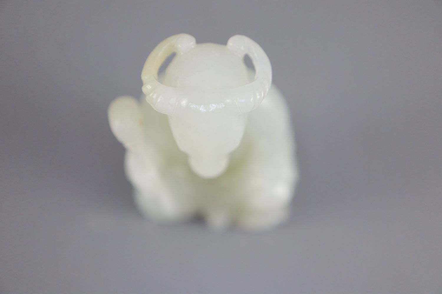 A Chinese pale celadon jade seated figure of a ram-headed immortal, seated wearing flowing robes and - Image 7 of 8