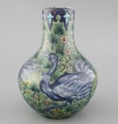 A rare William de Morgan 'Ostrich' bottle vase, c.1888-97, painted by Joe Juster, with a repeating