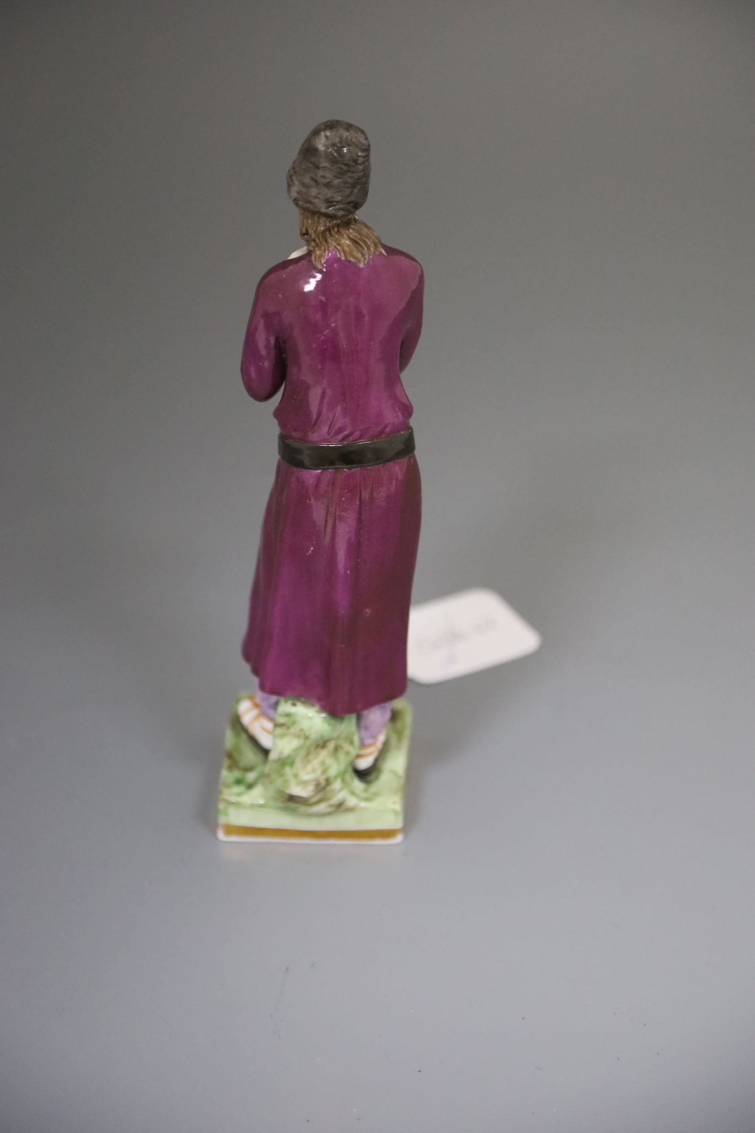 A Russian Gardner porcelain figure of a man holding a staff, mid 19th century, wearing traditional - Image 2 of 7
