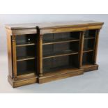 A William IV rosewood dwarf bookcase, with moulded top and four foliate capped columns dividing