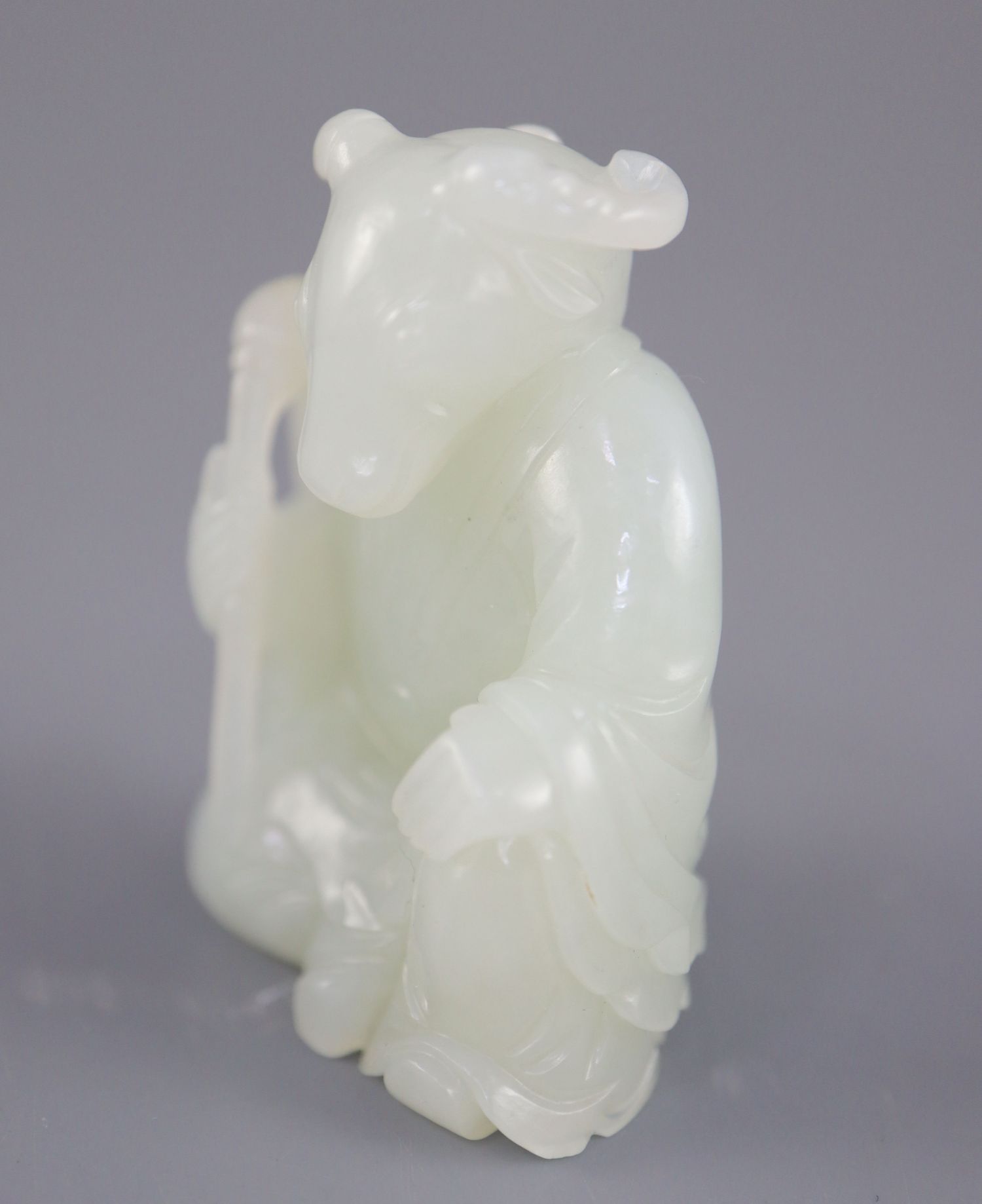 A Chinese pale celadon jade seated figure of a ram-headed immortal, seated wearing flowing robes and - Image 2 of 8