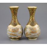 A pair of Japanese Satsuma pottery bottle vases, by Yabu Meizan, Meiji period, each finely painted
