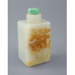 A Chinese pale celadon and russet jade rectangular snuff bottle, 19th century, the carver skillfully