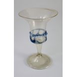 A Spanish façon de venise wine glass, 17th century, the trumpet shaped bowl enclosed by a