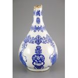 A Chinese blue and white pear-shaped vase, Kangxi period, painted with ribbon tied objects and vases