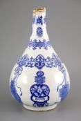 A Chinese blue and white pear-shaped vase, Kangxi period, painted with ribbon tied objects and vases