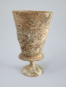 An Islamic colourless glass goblet, Iran, 12th century, the bucket shaped bowl with applied scrolled