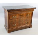 A 19th century French flame mahogany commode, with black granite top, divided frieze drawer and