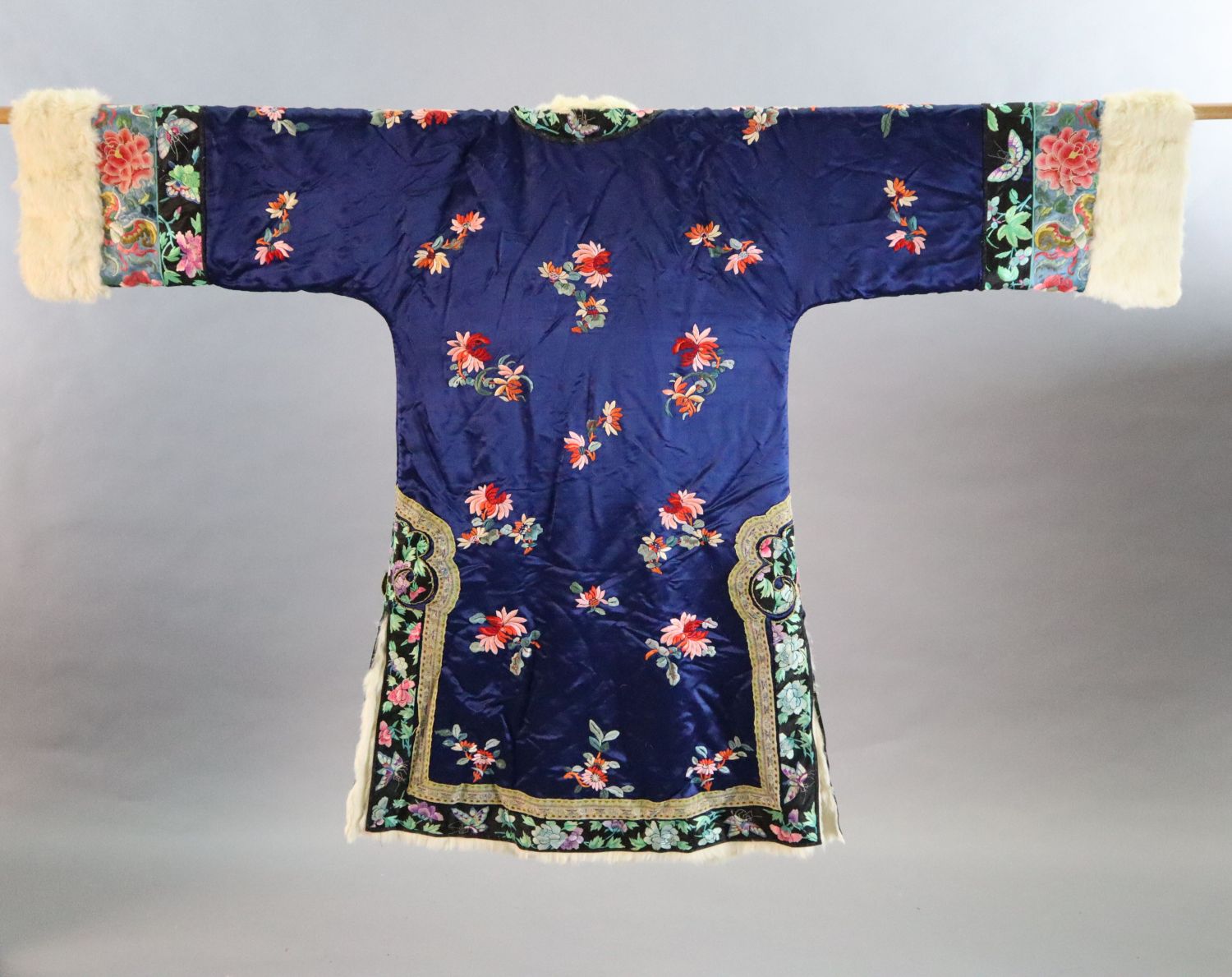 A Chinese blue silk multicoloured embroidered Chinese winter robe, early 20th century, with a - Image 2 of 2