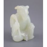 A Chinese pale celadon jade seated figure of a ram-headed immortal, seated wearing flowing robes and