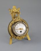An early 20th century French bronze and ormolu desk timepiece, of cartel clock form resting upon