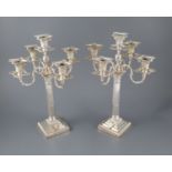 A pair of late Victorian silver corinthian column four branch, five light candelabra by Carrington &