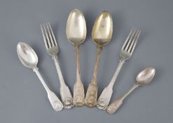 A part canteen of William IV silver double struck fiddle, thread and shell pattern flatware by