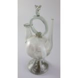 A Spanish Cantir glass vessel, 17th/18th century, with central ring handle with flame finial,