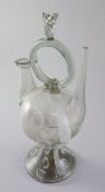 A Spanish Cantir glass vessel, 17th/18th century, with central ring handle with flame finial,