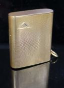 A 1920's engined turned 9ct gold mounted Dunhill lighter, by Finnigan's Ltd, London, 1928, with