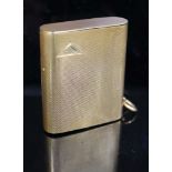 A 1920's engined turned 9ct gold mounted Dunhill lighter, by Finnigan's Ltd, London, 1928, with