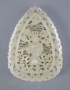 A Chinese pale celadon jade plaque, in Tang dynasty style, carved in relief and openwork with a