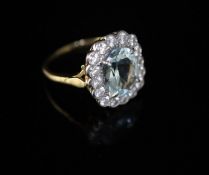 A modern 18ct gold, aquamarine and diamond cluster ring, size O/P, gross 5.5 grams.CONDITION: A