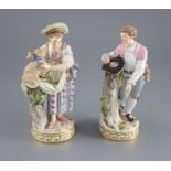 A pair of Meissen figures of a shepherd and shepherdess, 19th century, on circular gilt keywork