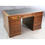 A Victorian mahogany twin pedestal partner's desk, with black leather skiver and eleven drawers