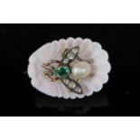 A late Victorian carved coral shell and inset pearl, emerald and rose cut diamond set bug brooch,