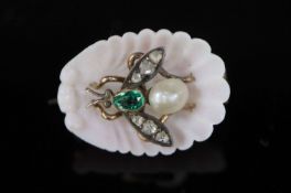 A late Victorian carved coral shell and inset pearl, emerald and rose cut diamond set bug brooch,