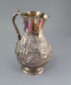 A large Victorian silver baluster hot water jug, by Robert Hennell IV, embossed with Scottish