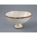 A Chinese Ding ware moulded stem bowl, Song-Jin dynasty or later, the interior relief moulded with