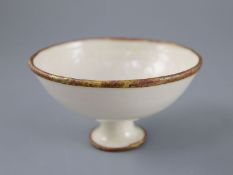 A Chinese Ding ware moulded stem bowl, Song-Jin dynasty or later, the interior relief moulded with