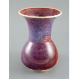 A Ruskin high fired flambe glazed vase, dated 1911, the interior and exterior with sang de boeuf,