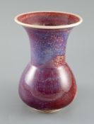 A Ruskin high fired flambe glazed vase, dated 1911, the interior and exterior with sang de boeuf,