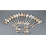 A set of eighteen Victorian silver double struck fiddle. thread and shell pattern dessert spoons,