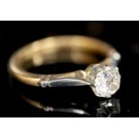 An 18ct gold and platinum, solitaire diamond ring, the old round cut stone weighing approximately
