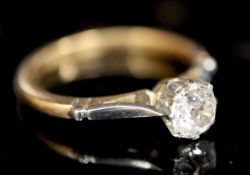 An 18ct gold and platinum, solitaire diamond ring, the old round cut stone weighing approximately